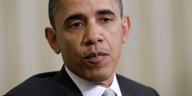 President Barack Obama speaks to reporters in the Oval Office of the White House in Washington, Monday, March 14, 2011, during his meeting with Danish Prime Minister Lars Lokke Rasmussen. (AP)