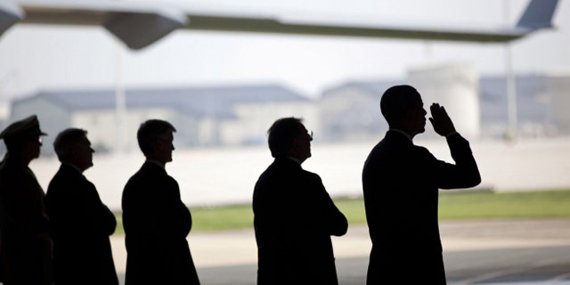 The White House released this picture of President Obama at Dover Air Force Base in Delaware on Aug. 9, 2011, receiving the planes carrying the bodies of the 30 U.S. service members killed when their helicopter was downed by an RPG in Afghanistan.