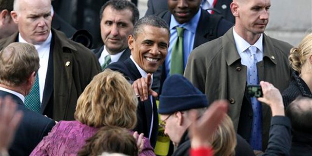 President Obama greets the crowd after addressing thousands of people in Dublin during his visit to Ireland May 23.