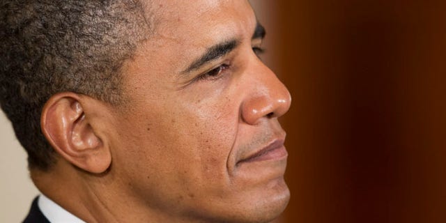 July 4, 2012: President Obama pauses during a naturalization ceremony for active duty service members in the East Room of the White House.
