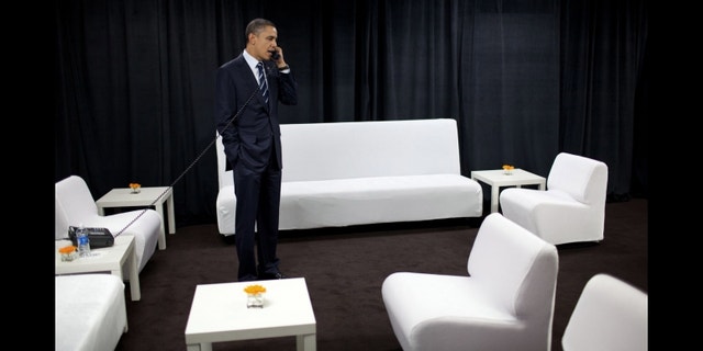 President Barack Obama talks on the phone with National Security Advisor Tom Donilon about developments in the Middle East, backstage at Intel Corporation in Hillsboro, Ore., Feb. 18, 2011. (Official White House Photo by Pete Souza)