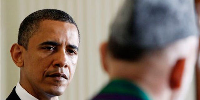President Obama and Afghan President Hamid Karzai are shown during their joint news conference at the White House in Washington May 12. (AP Photo)