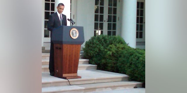 A small rodent (lower right corner) scurries in front of President Obama during remarks about Wall Street reform. Fox Photo by Bryan Cole