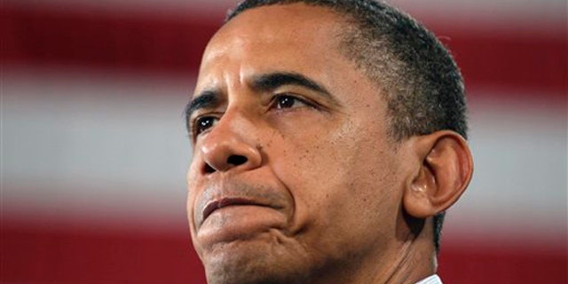Tuesday: President Obama pauses as he speaks during a Rural Economic Forum in Peosta, Iowa.