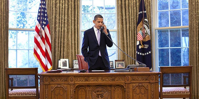 President Obama talks with Hamid Karzai about the Afghanistan election on a phone call from the Oval Office Nov. 2. (White House Photo)