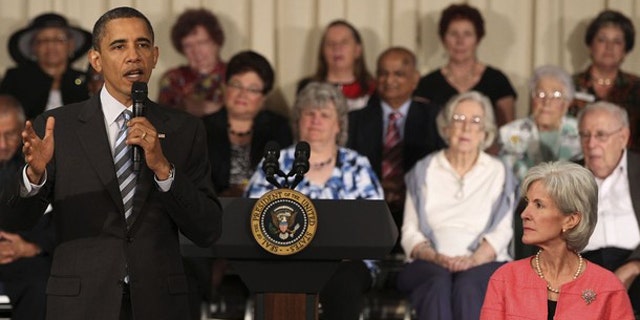 President Obama speaks next to Health and Human Services (HHS) Secretary Kathleen Sebelius (R) as he holds a town hall meeting at the Holiday Park Multipurpose Senior Center, June 8, 2010. (Reuters)