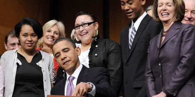 President Obama signs the Health Care and Education Reconciliation Act into law at Northern Virginia Community College in Alexandria, Va., March 30. (Reuters Photo)