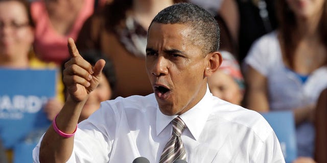 Oct. 25, 2012: President Obama gestures while speaking at a campaign event at Ybor Centennial Park in Tampa, Fla.
