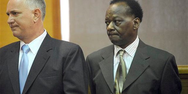Sept. 29: Onyango Obama, right, uncle of President Barack Obama, waits with defense attorney Scott Bratton in Framingham, Mass., District Court, during a hearing on an August drunken driving charge.