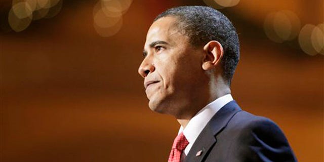 Sunday: President Obama speaks at a Christmas event held at the National Building Museum in Washington. (AP Photo)