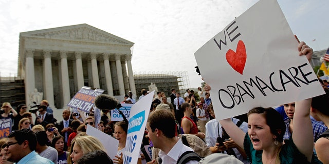 FILE: June 28, 2012: Supporters of President Barack Obama's health care law celebrate outside the Supreme Court in Washington, D.C.