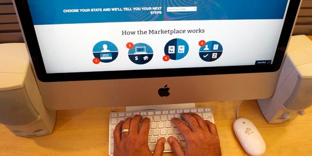 A man looks over the Affordable Care Act signup page on the HealthCare.gov website in New York in this October 2013 file photo.