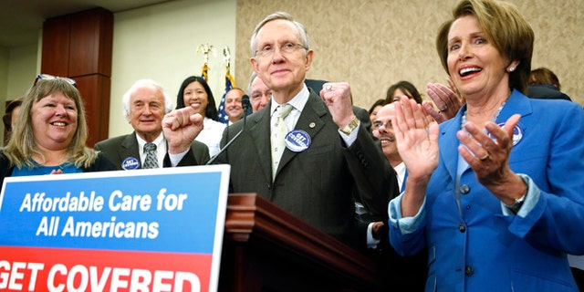 Oct. 1, 2013: U.S. Senate Democratic leader Harry Reid (C) and House Minority Leader Nancy Pelosi (R) lead a rally to celebrate the start of the Affordable Care Act (commonly known as Obamacare) at the U.S. Capitol in Washington.