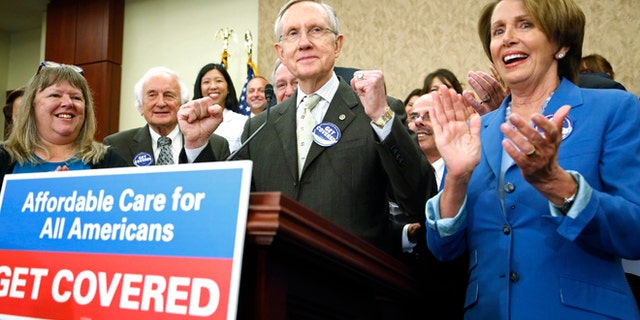 Oct. 1, 2013: U.S. Senate Democratic leader Harry Reid (C) and House Minority Leader Nancy Pelosi (R) lead a rally to celebrate the start of the Affordable Care Act (commonly known as Obamacare) at the U.S. Capitol in Washington.