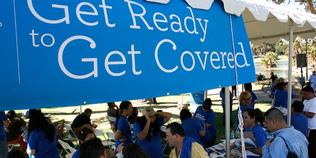 September 28, 2013: People gather for information during a Planned Parenthood Affordable Care Act outreach event.