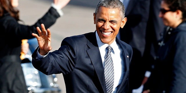 May 8, 2015: President Obama waves to supporters before leaving the Watertown Regional Airport in Watertown, S.D., where he gave a commencement address at a community college. (AP)