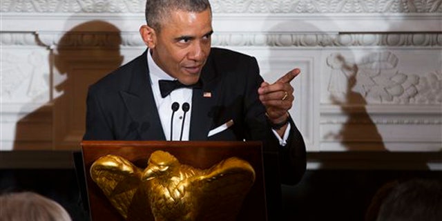 President Barack Obama delivers remarks during a National Governors Association dinner in the State Dining room of the White House, on Sunday, Feb. 21, 2016, in Washington. (AP Photo/Evan Vucci)
