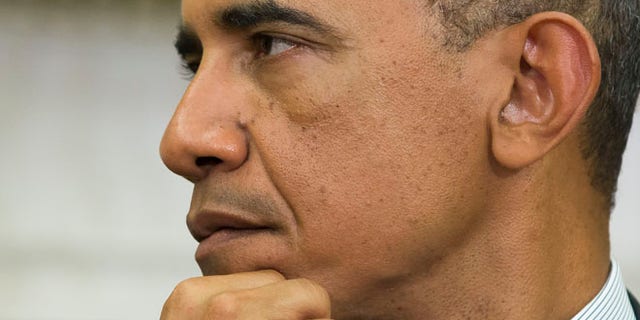 Sept 18, 2014: President Barack Obama listens to Ukrainian President Petro Poroshenko speak after a meeting in the Oval Office of the White House. (AP)