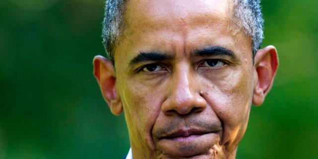 Aug 11, 2014: President Barack Obama pauses as he speaks about developments in Iraq from his vacation residence in Chilmark, Mass., during his family vacation on the island of Martha's Vineyard.