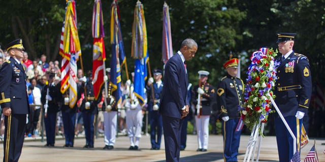 May 25, 2015: President Obama, center accompanied by Maj. Gen. Jeffrey S. Buchanan, left, Commander of the U.S. Army Military District of Washington, and Sgt. 1st Class John C. Wirth, right.