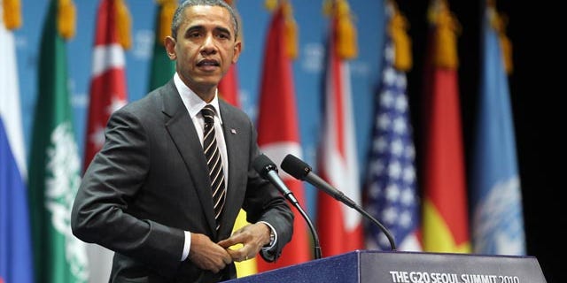 Nov. 12: Obama gestures during a closing press conference at the G20 Summit in Seoul, South Korea. Obama said the decision by the Federal Reserve to pump $600 billion into the U.S. economy was designed to give a boost to a slow recovery and address fears of deflation.