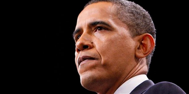 President Obama pauses during his speech about the war in Afghanistan at West Point, N.Y., Dec. 1. (AP Photo)