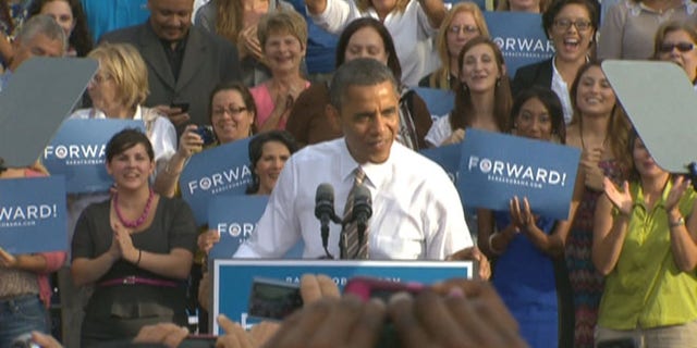 PLAY 'FIND THE GUYS': President Obama revs up a Tampa crowd on Oct. 25, 2012, with women supporters filling up the risers behind him -- as both candidates appeal to female voters.
