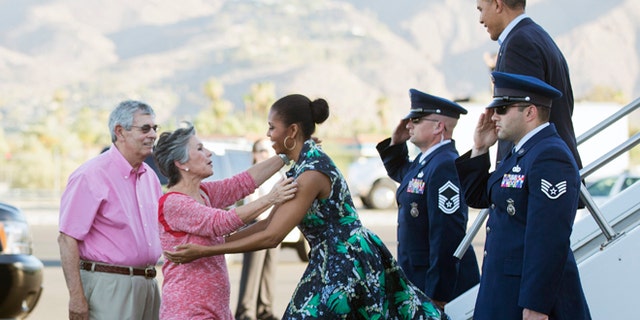 June 13, 2014: President Barack Obama and first lady Michelle Obama, are greeted on the tarmac by Sen. Barbara Boxer, D-Calif., second from left, and her husband Stewart Boxer, left, as they arrive in Palm Springs, Calif.  (AP)