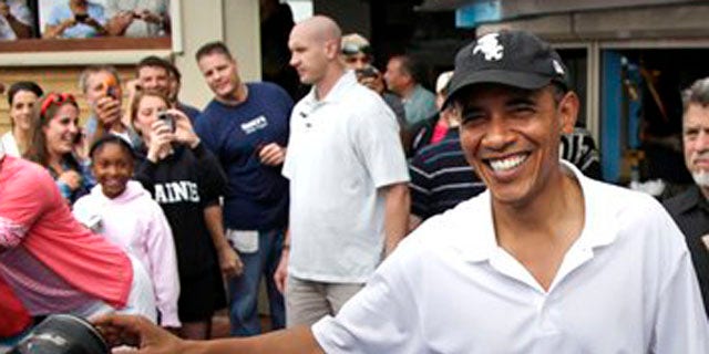 Aug. 25, 2010: President Obama greets people outside Nancy's Restaurant in Oak Bluffs, Mass., while the first family is vacationing on Martha's Vineyard.