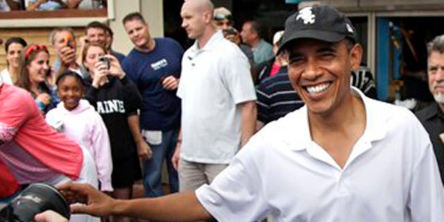 Aug. 25, 2010: President Obama greets people outside Nancy's Restaurant in Oak Bluffs, Mass., while the first family is vacationing on Martha's Vineyard.