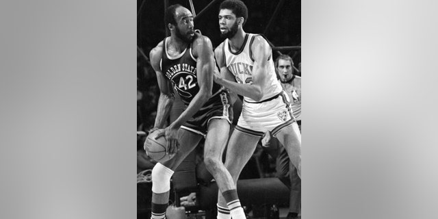 March 30, 1973: Nate Thurmond of the Golden State Warriors (42) looks back at Kareem Abdul-Jabbar of the Milwaukee Bucks before making his move toward the basket during NBA playoff action at Milwaukee, Wis.