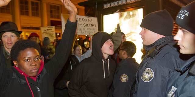 Nov. 5, 2011: A protestor yells at police after Occupy Atlanta protestors and an officer clashed as he was driving through the crowd on a motorcycle in Atlanta.