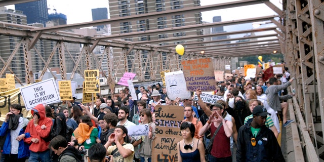 Oct. 1: Protesters walk onto New York's Brooklyn Bridge before police began making arrests during Saturday's march by Occupy Wall Street.