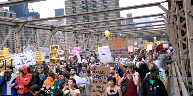 Oct. 1: Protesters walk onto New York's Brooklyn Bridge before police began making arrests during Saturday's march by Occupy Wall Street.