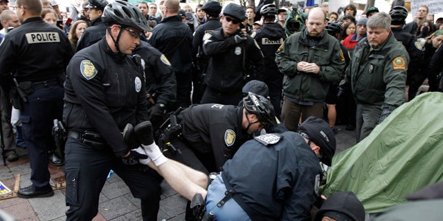 Oct. 5: Police arrest a man who refused to leave a tent pitched at an "Occupy Seattle" protest encampment in downtown Seattle's Westlake Park.