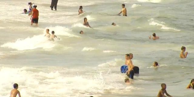 Swimmers in the ocean in Ocean City, Maryland.