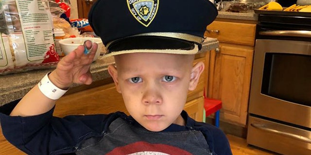 Surrounded by family and friends, 4-year-old honorary Colorado Springs Police Officer Joshua Salmoiraghi finished his last round of chemotherapy Sunday.