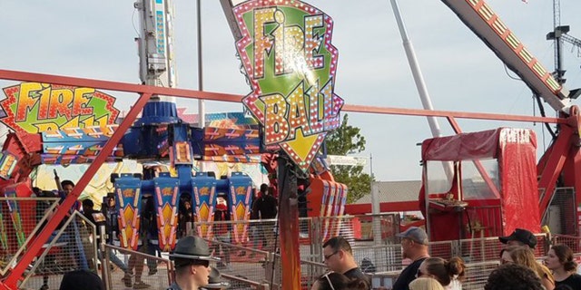 Authorities respond after the Fire Ball amusement ride malfunctioned injuring several at the Ohio State Fair, Wednesday, July 26, 2017, in Columbus, Ohio.