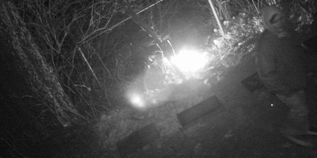 Surveillance images captured a fire at the cemetery.