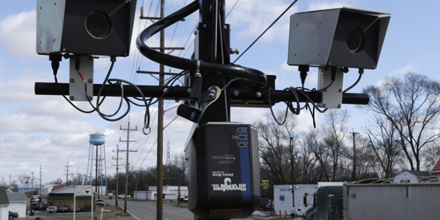 Feb. 25, 2014: Speeding cameras are aimed at traffic moving on US Route 127 in New Miami, Ohio.