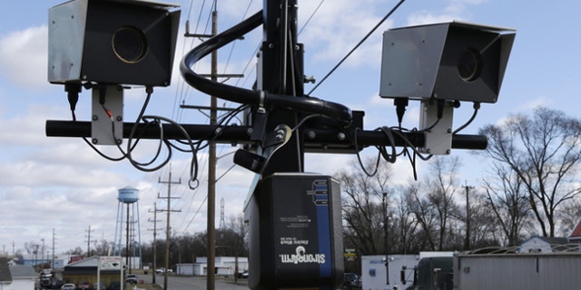 Feb. 25, 2014: Speeding cameras are aimed at traffic moving on US Route 127 in New Miami, Ohio.