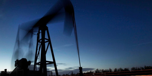 March 6, 2012: A pumping unit sucks oil from the ground near Greensburg, Kan. U.S. oil output is surging so fast that the United States could soon overtake Saudi Arabia as the world's biggest producer. 2012 marked the fourth straight year of crude increases.