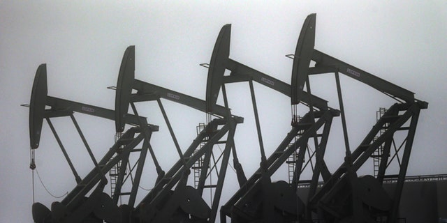 Dec. 19, 2014: Oil pump jacks are shown in Williston, N.D.