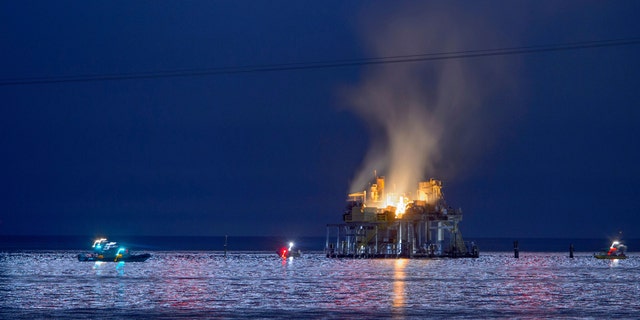 Jefferson Parish, La., authorities and others from other parishes respond to an oil rig explosion in Lake Pontchartrain off Kenner, La., Sunday, Oct. 15, 2017.