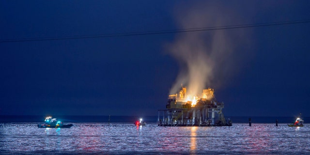 Jefferson Parish, La., authorities and others from other parishes respond to an oil rig explosion in Lake Pontchartrain off Kenner, La., Sunday, Oct. 15, 2017.