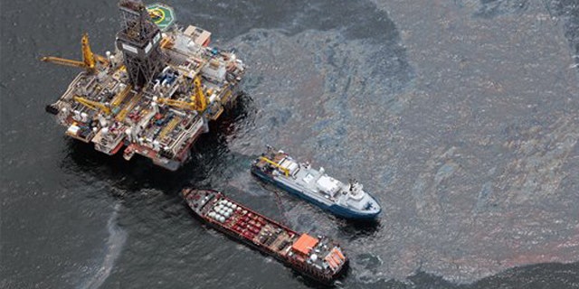 July 16, 2010: Workboats operate near the Transocean Development Drilling Rig II at the site of the Deepwater Horizon incident in the Gulf of Mexico. The wellhead has been capped and BP is continuing to test the integrity of the well before resuming production.