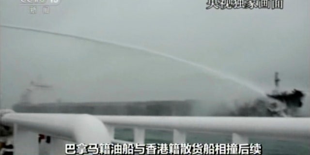 A rescue ship sprays water to put out a blaze at the Panama-registered tanker "Sanchi."