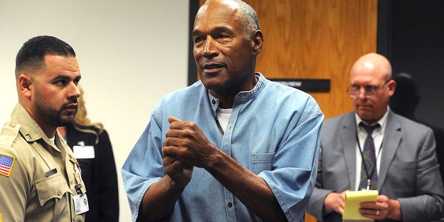 Nevada's parole board says it didn't consider O.J. Simpson's 1989 conviction for misdemeanor spousal abuse when it granted him parole in July because it wasn't listed in the federal clearinghouse of FBI crime data. Simpson is pictured reacting to news that he was granted parole, in Lovelock, Nev., July 20, 2017.