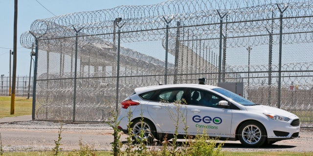 A GEO corrections vehicle patrols outside of the Great Plains Correctional Facility in Hinton, Okla, Monday, July 10, 2017.