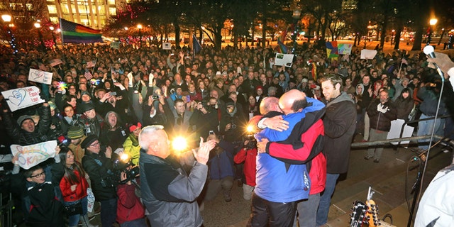Dec. 23, 2013: Dan Trujillo, left, and Clyde Peck get married as about 1,500 people gather to show support of marriage equality at Washington Square, just outside of the Salt Lake City and County Building in Salt Lake City.